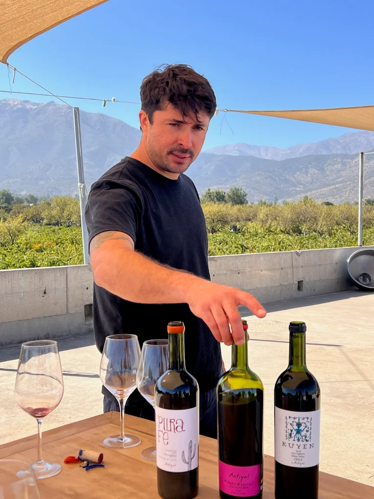 Clemente serving wine at Viña Antiyal, Maipo Valley
